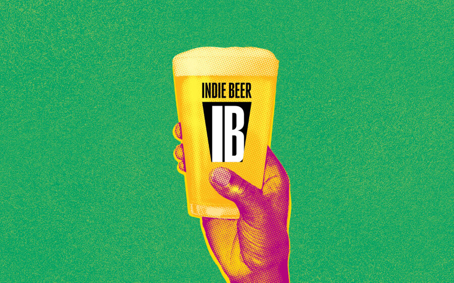 SIBA Indie Beer Campaign Landscape A hand holding up a pint glass of beer brewed by a truly independent brewery. Northern Latitudes is an independent brewer and a member of SIBA.