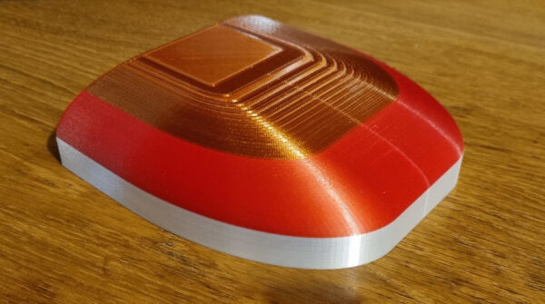 completed cover section half of one of the plastic covers for the brewery walls in white, copper and red