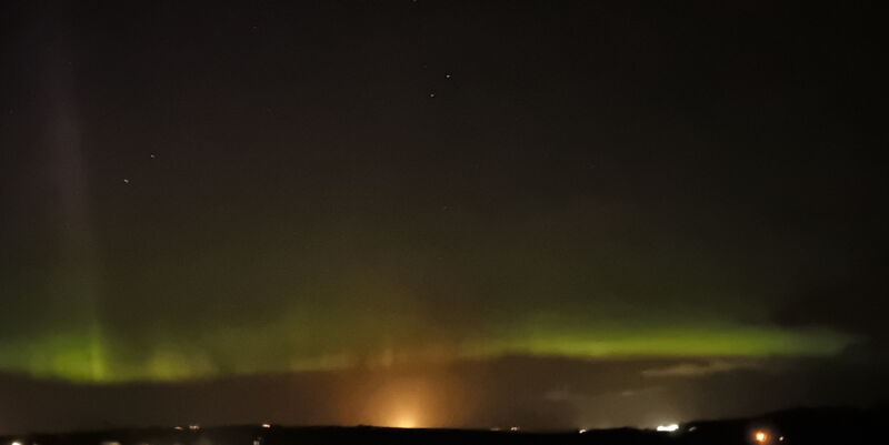Mirrie dancers in Orkney with light pollution A green band of aurora borealis with possible STEVE seen looking towards Scapa Flow where moored tankers are causing light pollution and spoiling the display.