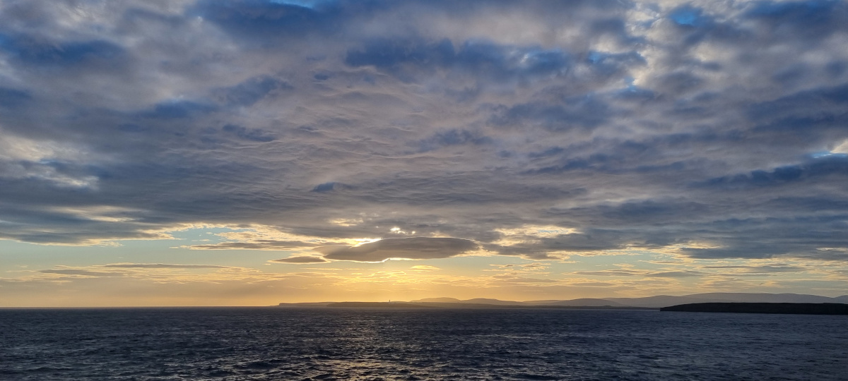 Sunset seen looking West towards Hoy from the Pentalina crossing the Pentland Firth.