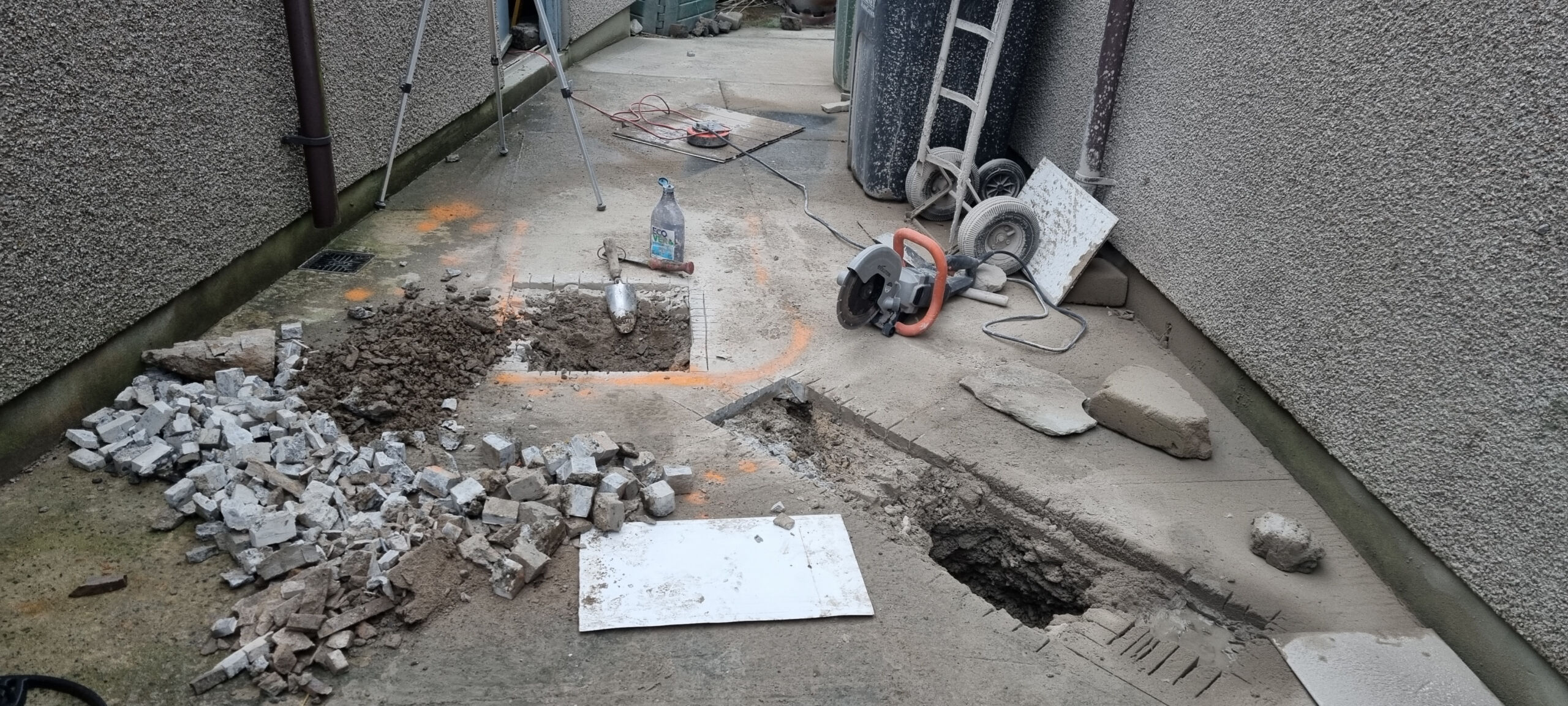 A disc stone cutter has been used to cut away the concrete patio surface outside the brewery.