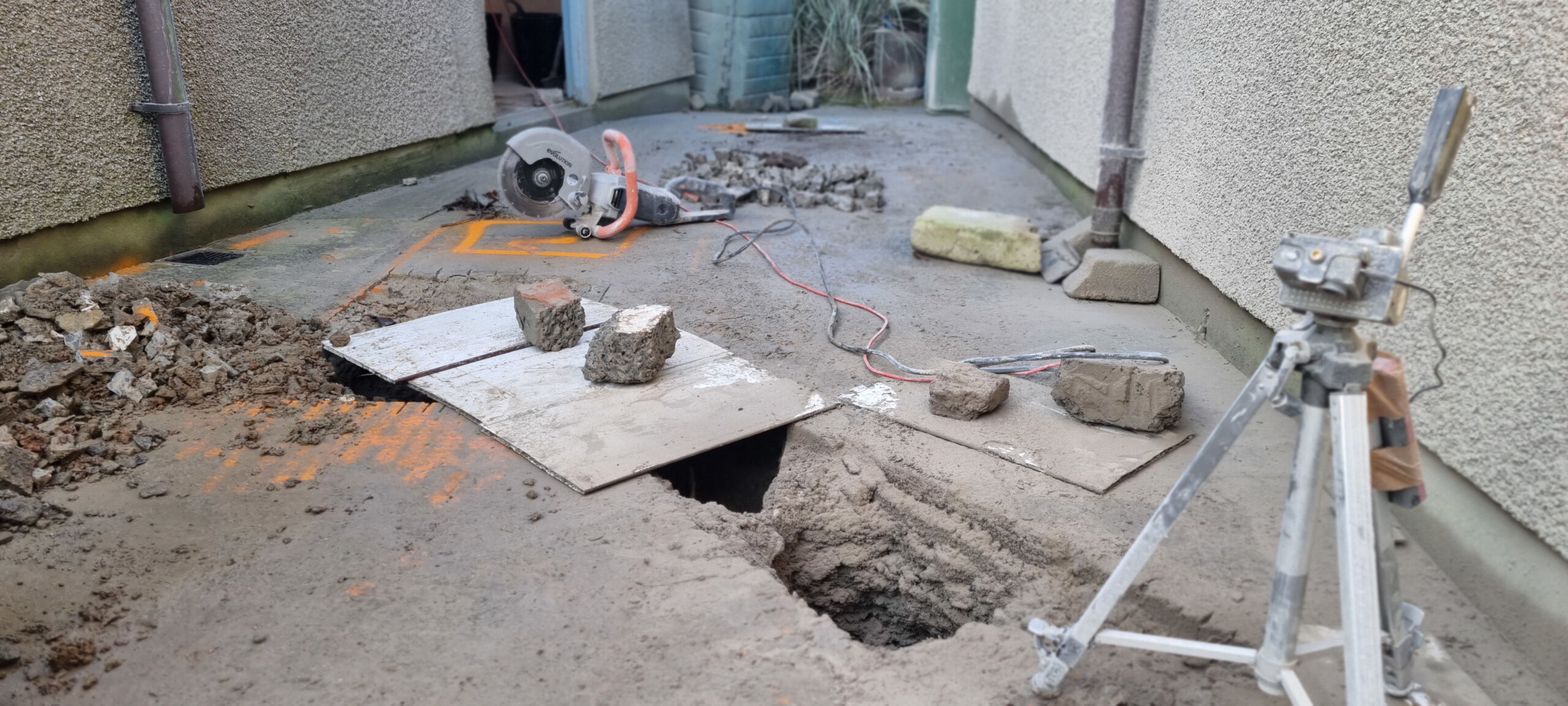 A disc stone cutter has been used to cut away the concrete patio surface outside the brewery.